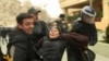 Azerbaijan -- Ata Abdullayev being detained by police during the opposition protest in Baku, 17Apr2011