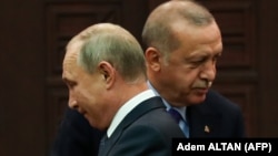 Recep Tayyip Erdogan (sağda) və Vladimir Putin ötən il Suriya danışqılarından sonra